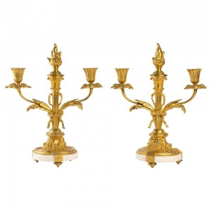 Pair of golden bronze candelabres and marble