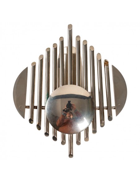 Prototype of chrome-plated metal with futuristic organ motif. electric system at the back of the room.

france, 1970