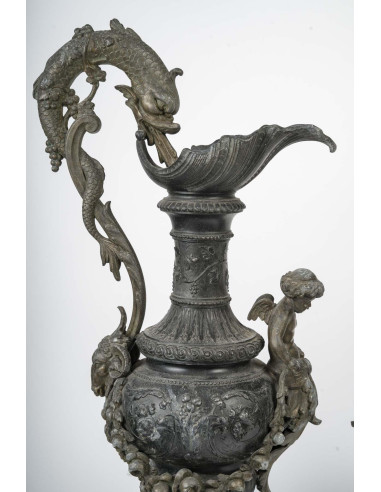 Pair of regule ewers on marble base.