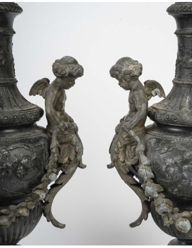 Pair of regule ewers on marble base.