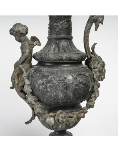 Pair of regule ewers on marble base.