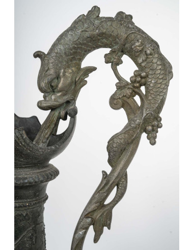 Pair of regule ewers on marble base.