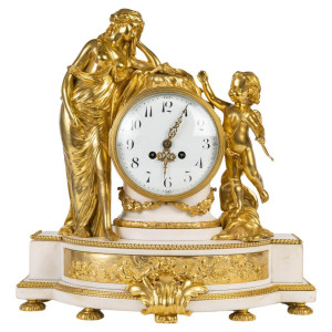 Relógio em bronze dourado e...