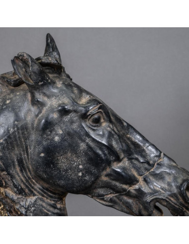 Sculpture of a black horse's head,...