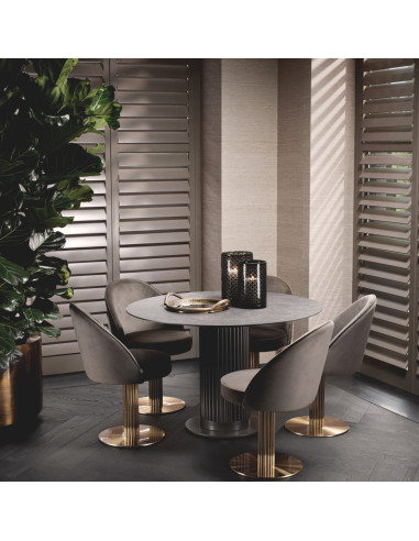 Round dining table in a bronze finish...