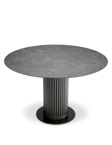 Round dining table with a bronze...