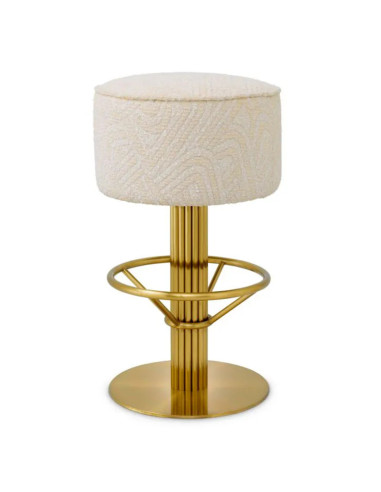 Brass bar stool with cream-colored...
