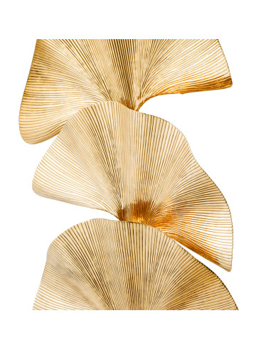 Polished brass floor lamp with a palm...
