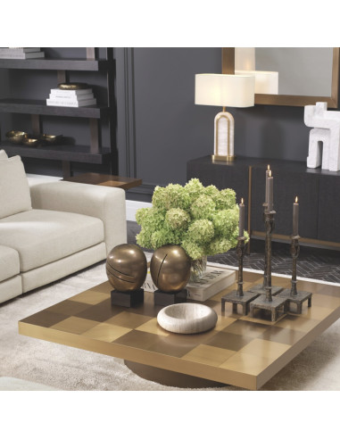 Square side table in a brushed brass...